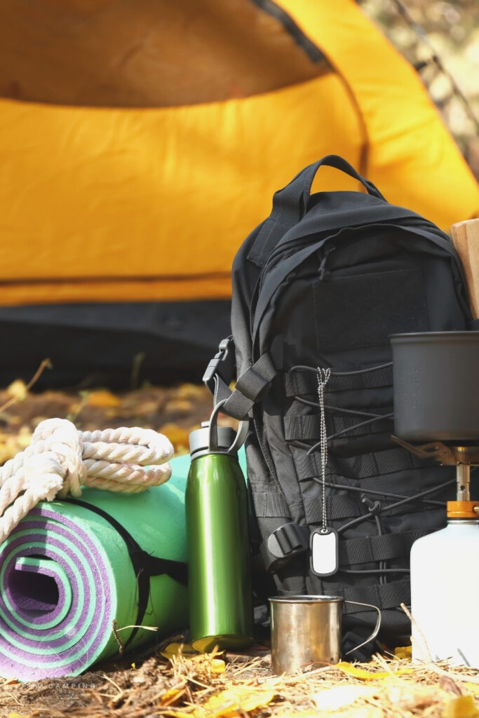 camping tent, backpack, steel mug, mattress pad and other camping gear
