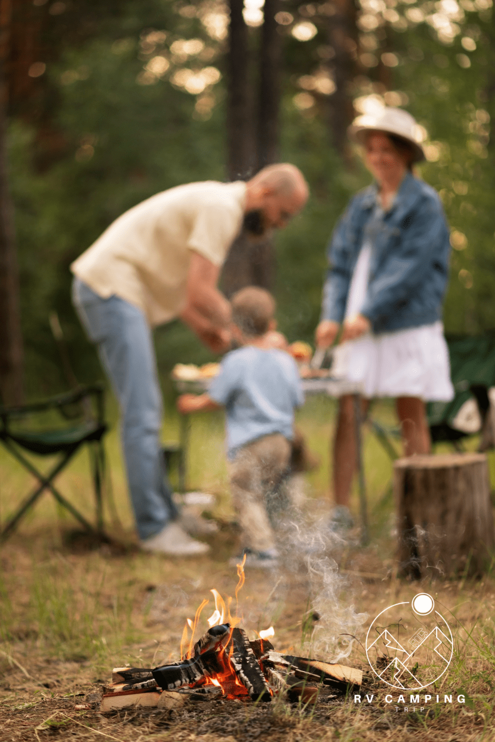 Family camping with an outdoor campfire