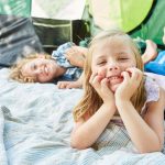 Children Laze Together While tent Camping